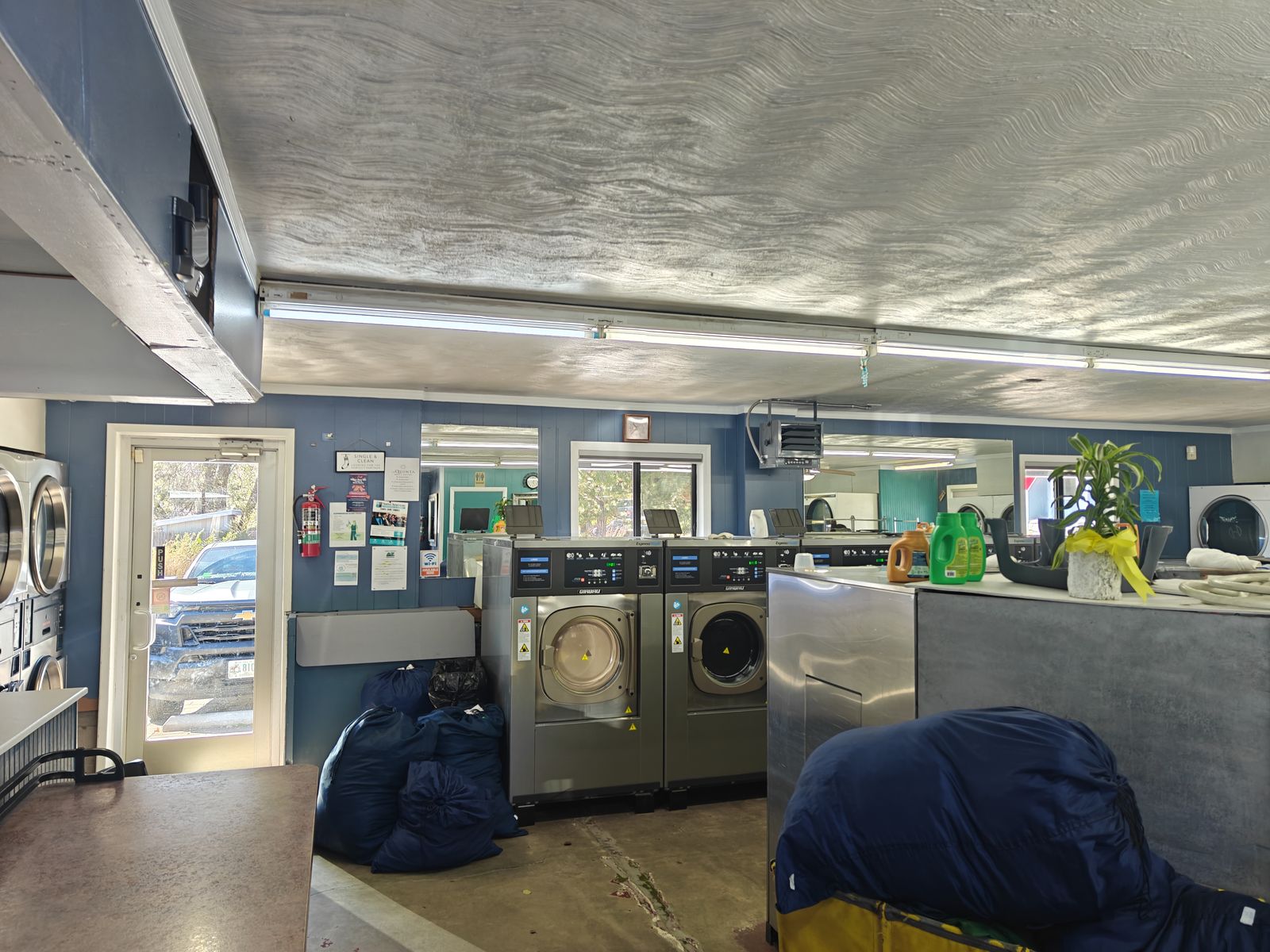Rows of washers inside Estrella Laundry